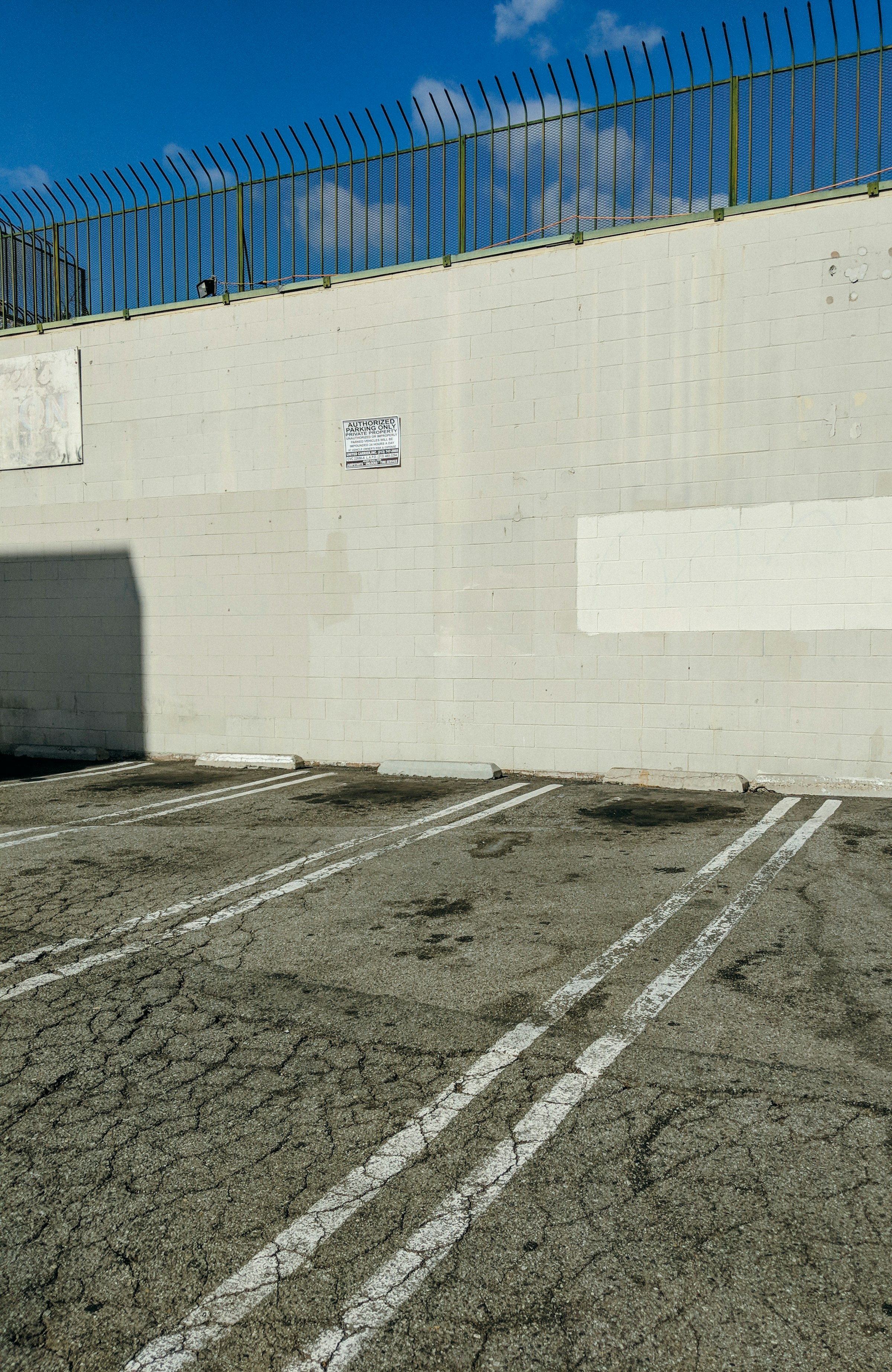 Empty parking lot with marked spaces